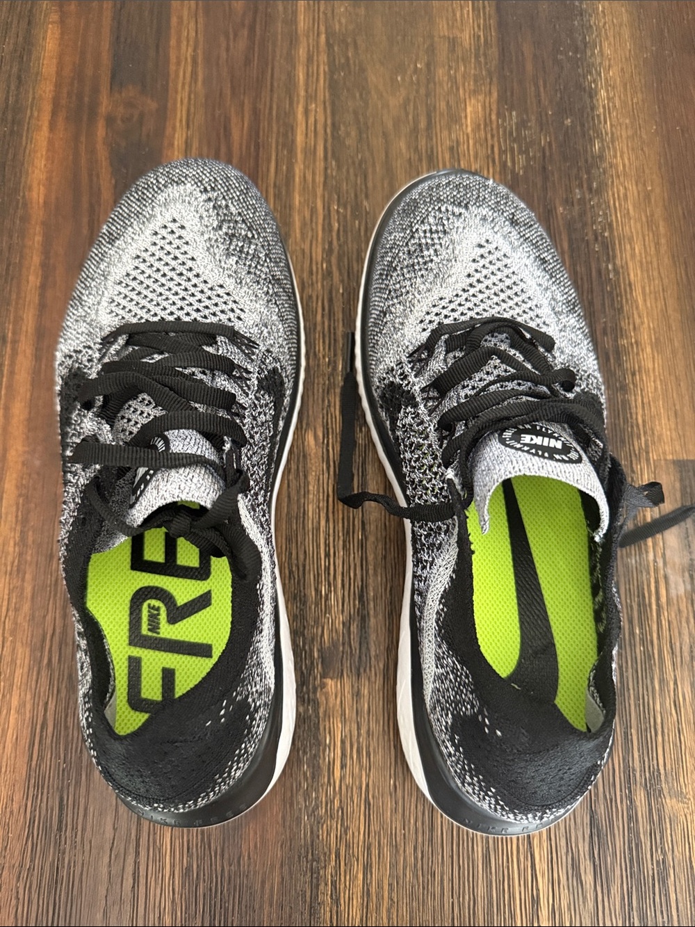 Nike Men’s Black & White Flyknit Sneakers with Neon Green Insoles